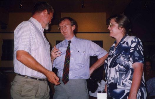 Three people talking.