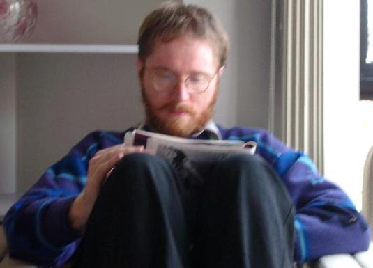 Mark reading New Scientist.